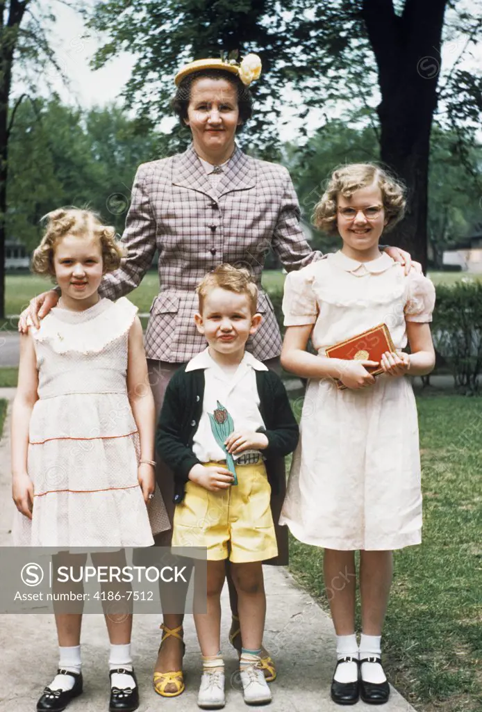 1950S Mother And Three Children All Dressed Up Posing For Photo Outdoors