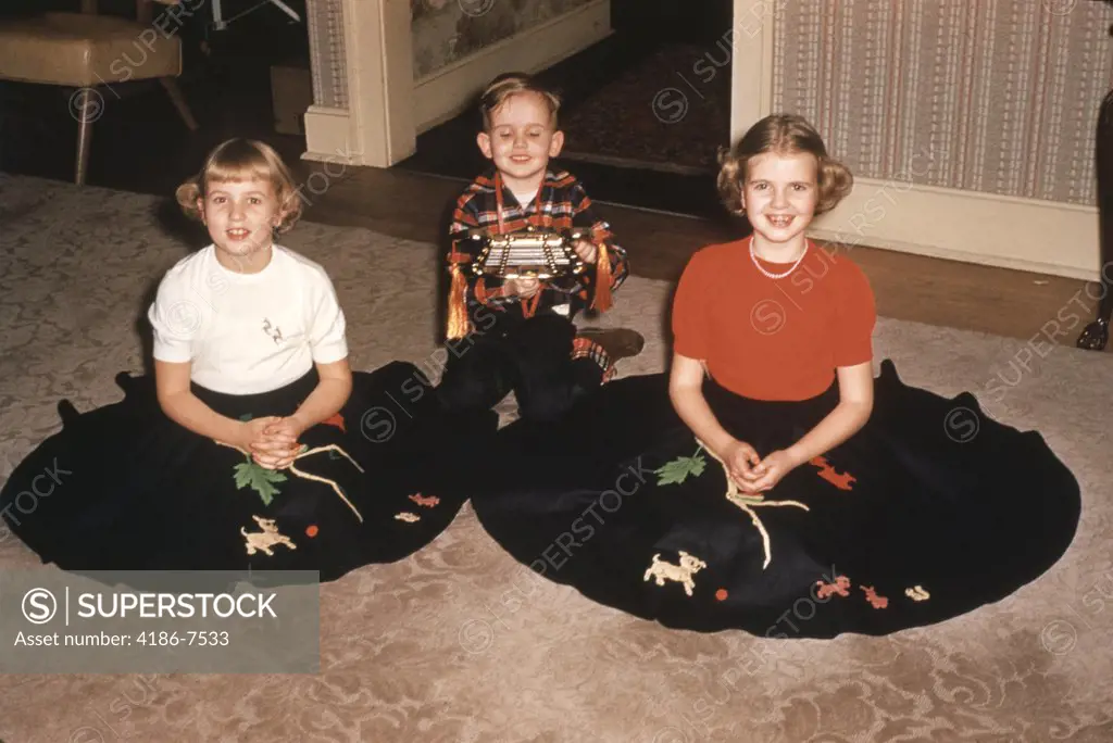 1950S Three Children Sitting On A Rug 1954 Photo Girls Wearing Poodle Skirts