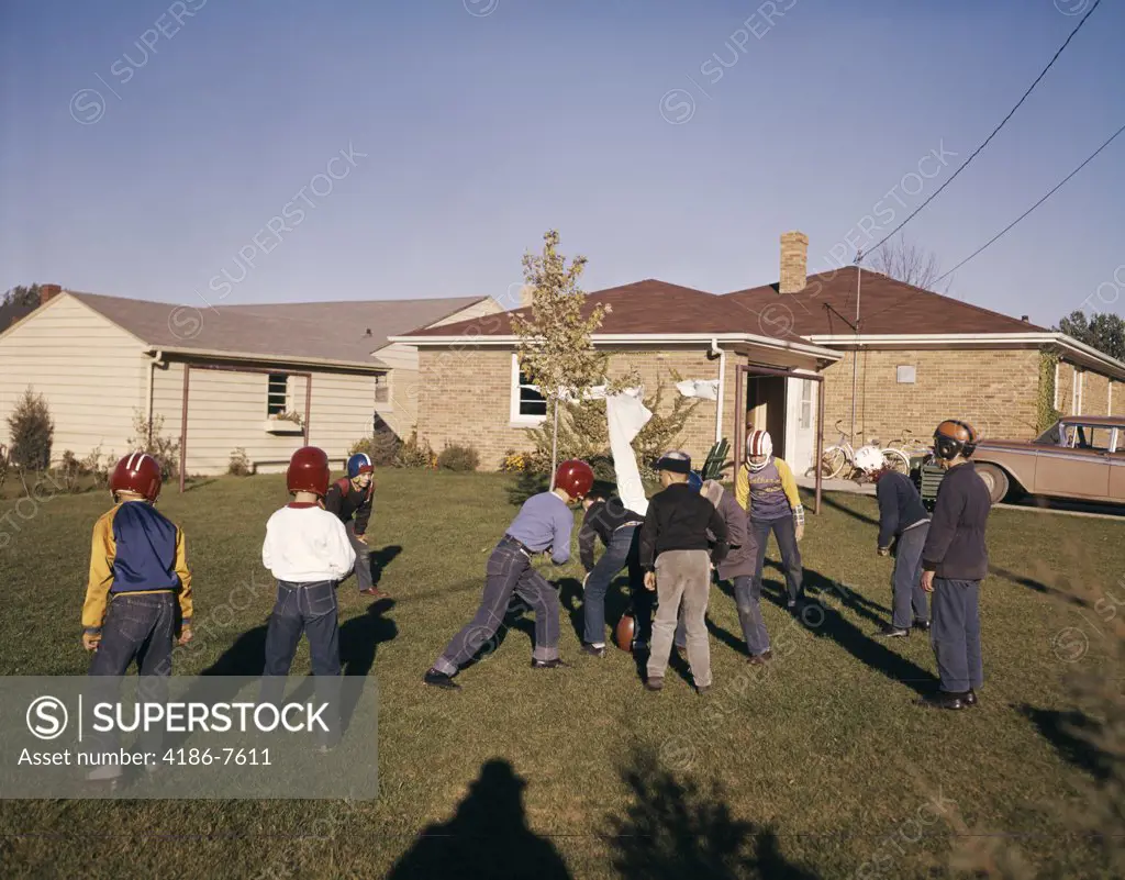 1950S 1960S Group Of Boys Playing Touch Football In Suburban Neighborhood House Yard