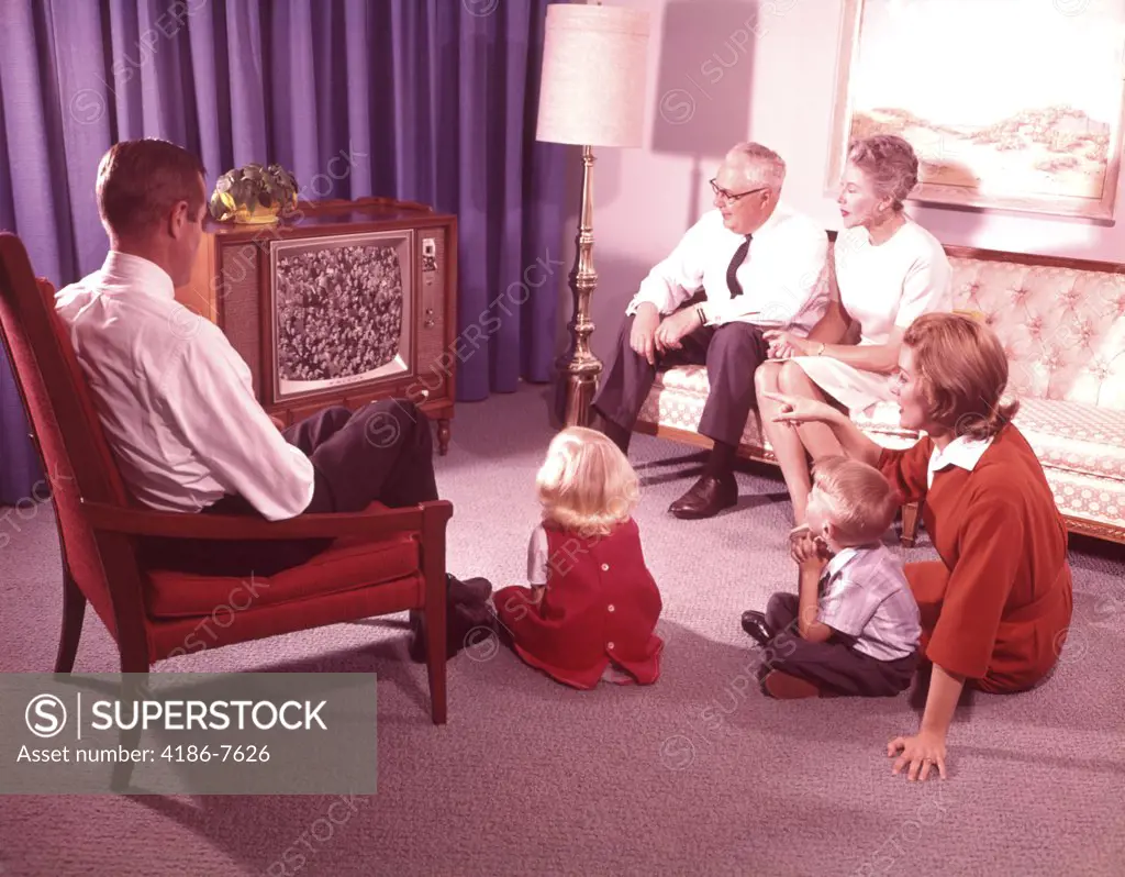 1960S Three Generation Family Watching Television  In Living Room
