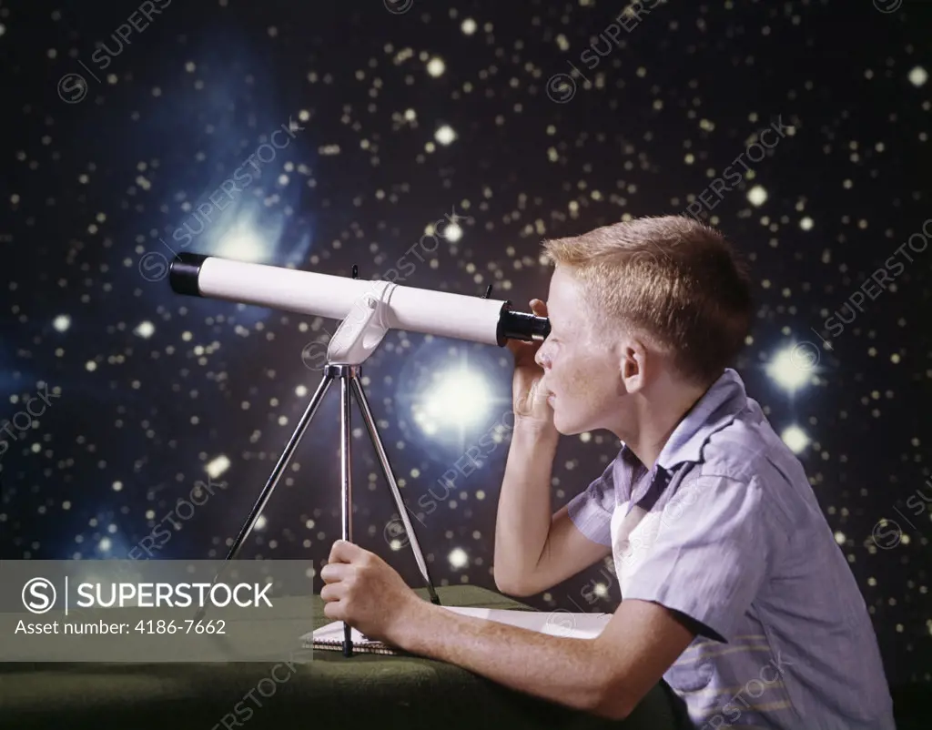 1960S Composite Boy With Telescope On Table Looking At Night Sky With Stars Galaxy Nebula