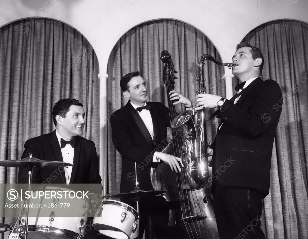 1950S Three Men In Tuxedos Musical Trio With Drums Upright Base And Saxophone