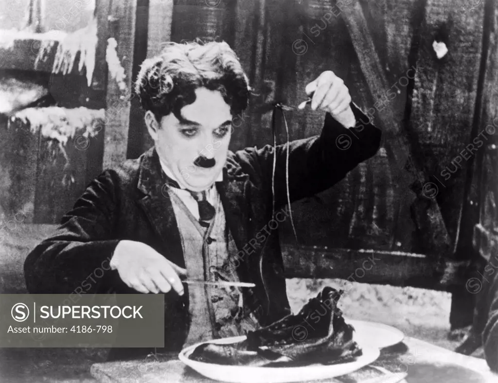 1920S Charles Chaplin Eating Shoe In Scene From 1925 Film The Gold Rush