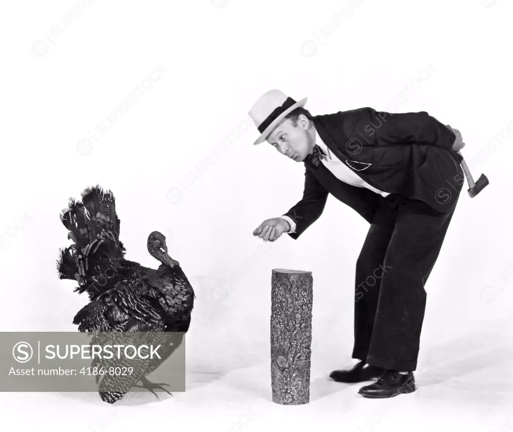 1930S 1940S Man Character With Hatchet Trying To Catch A Thanksgiving Turkey