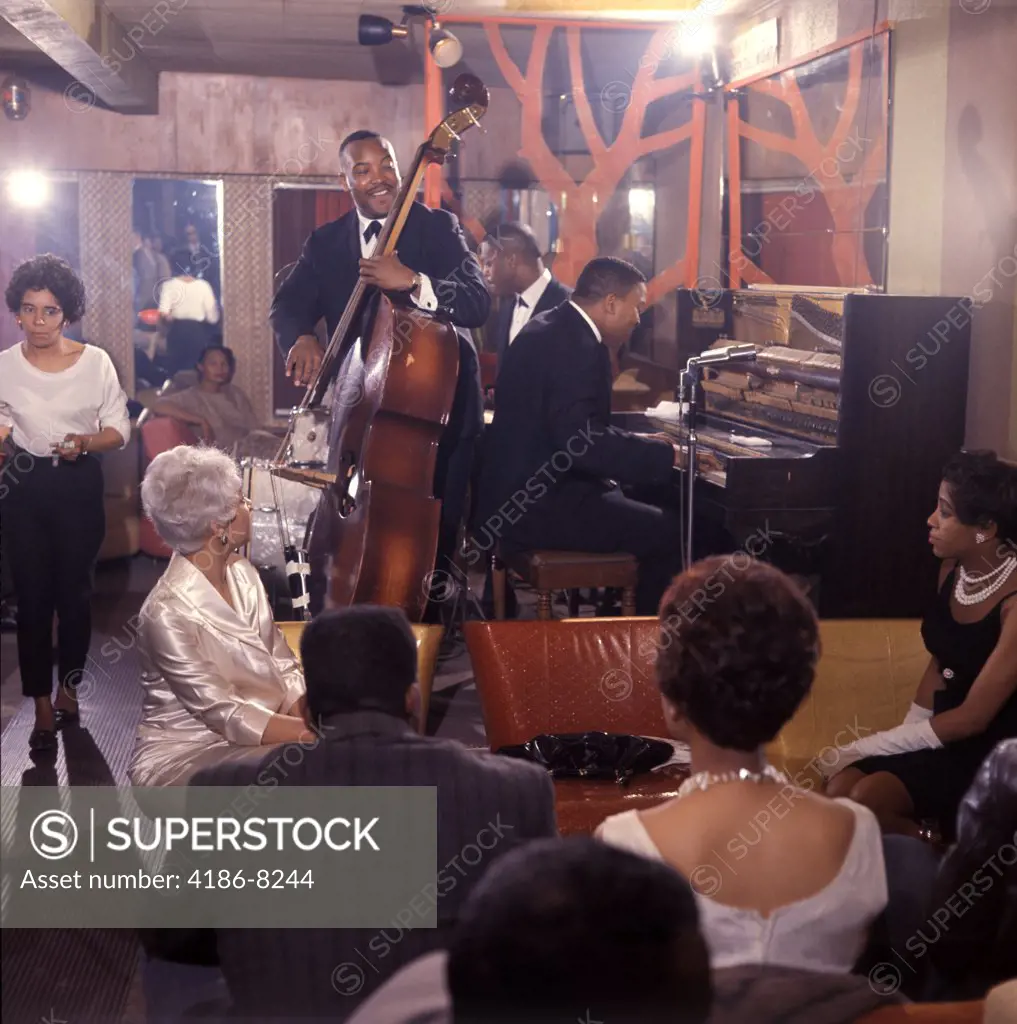 1960S African American Jazz Trio And Black Audience Playing In Night Club Lounge