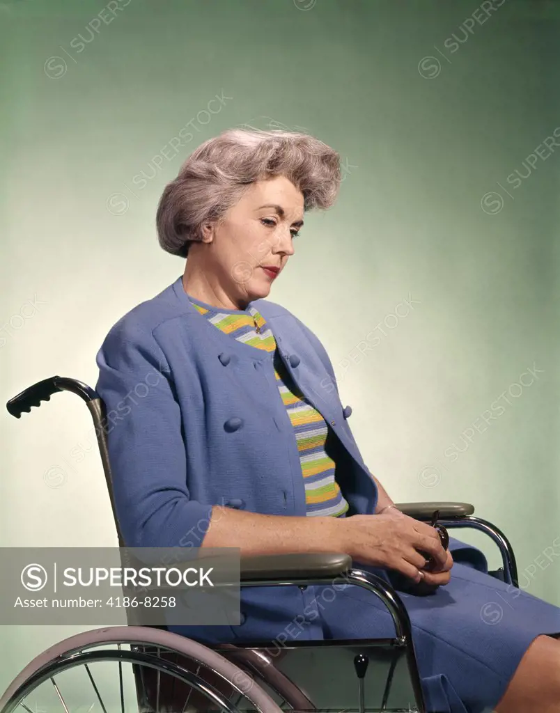 1960S Sad Senior Woman Sitting In Wheelchair