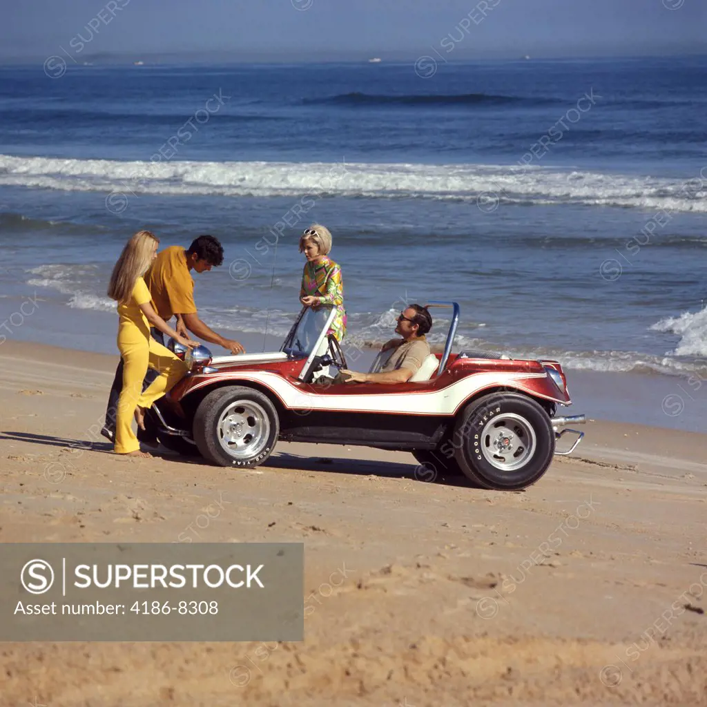1970S 2 Couples Men Women On Beach With Red White Dune Buggy Leisure Sport Lifestyle Vehicle Fun Summer