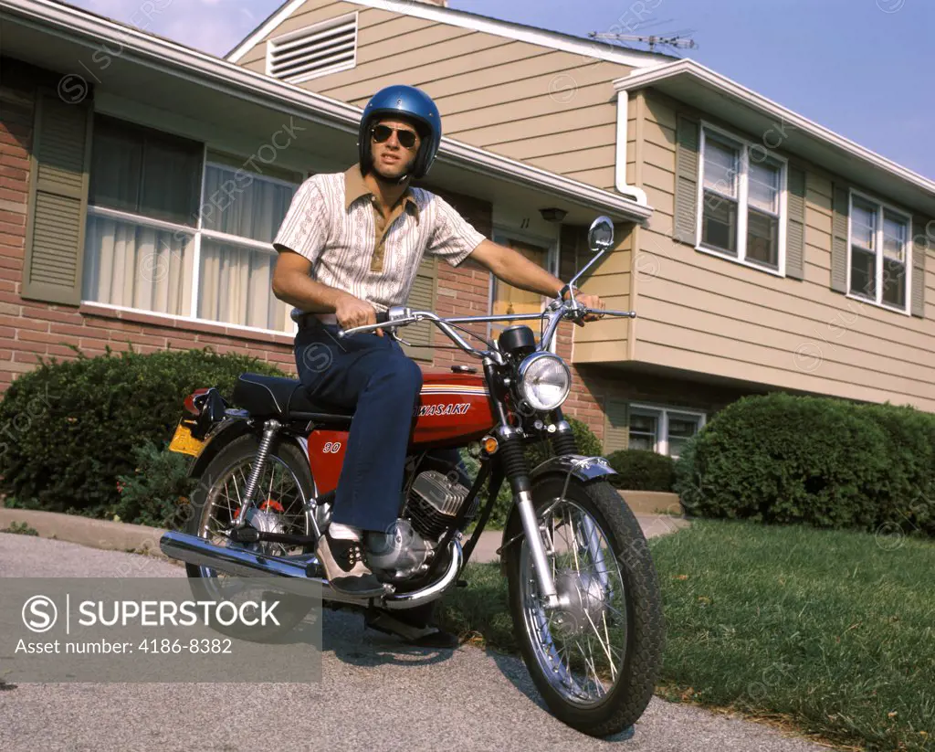 1970S Young Man Blue Helmet Sitting On Motorcycle In Driveway Suburban House Bike Motorcycles Men