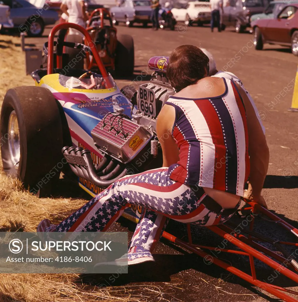 1960S 1970S Man Wearing Patriotic Clothes Working On Engine Of Drag Racing Car