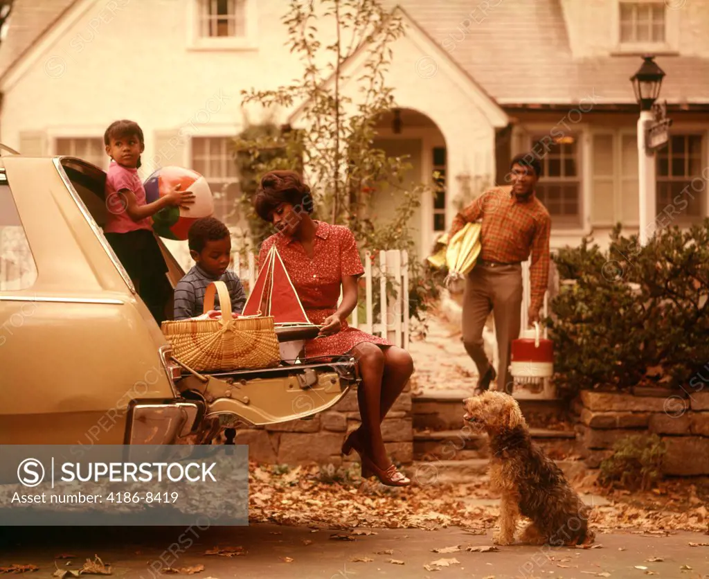 1970S African-American Family Loading Station Wagon Picnic Dog Mother Father Boy Girl Suburban   House