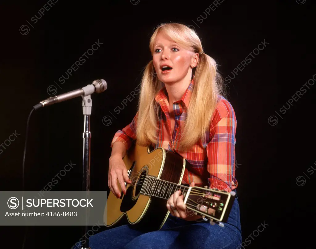 1970S Blond Young Woman Ponytails Plaid Shirt Jeans Play Guitar Singing Microphone Folk Singer Singers