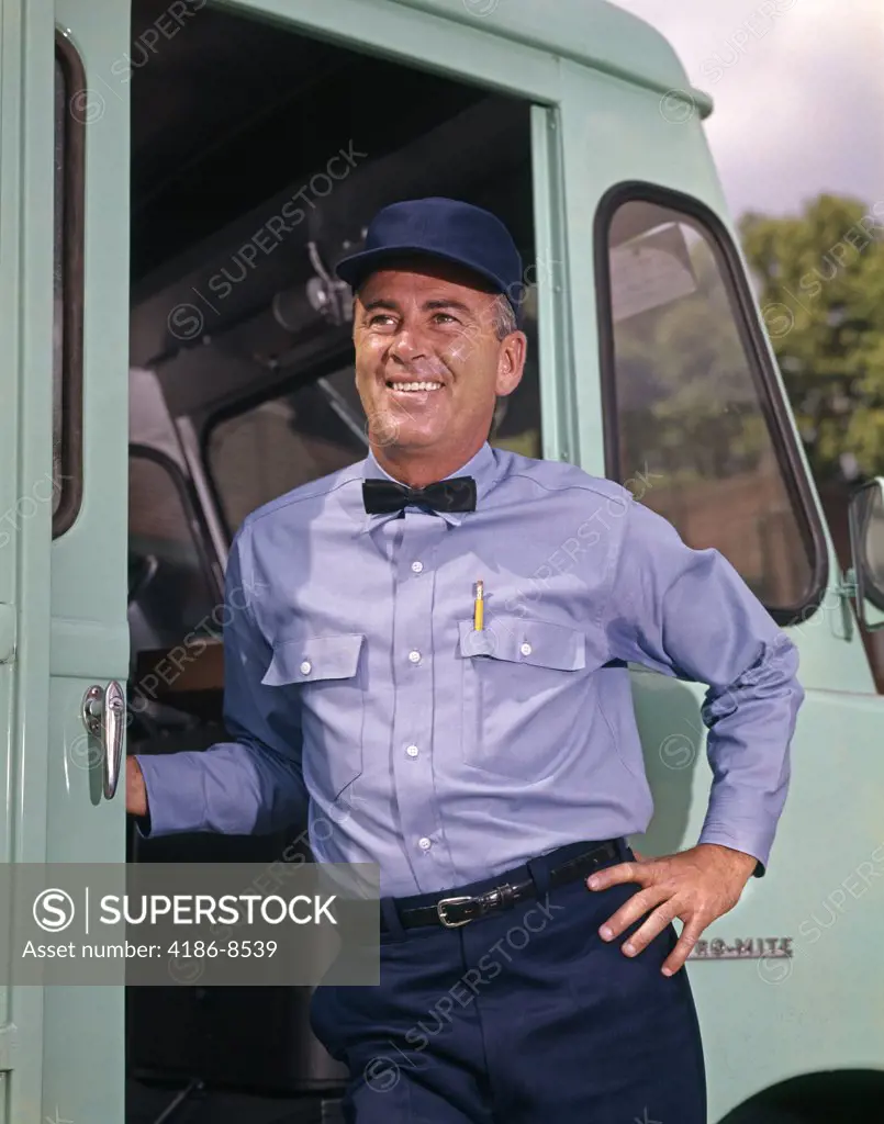 1950S 1960S Smiling Delivery Man Wearing Uniform Work Clothes Hat Bow Tie Standing In Door Of Step Van Truck