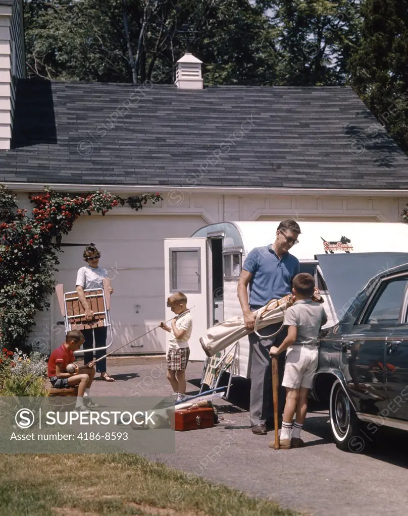 1960S Family Father Mother 3 Sons Loading Car And Trailer For Camping Vacation