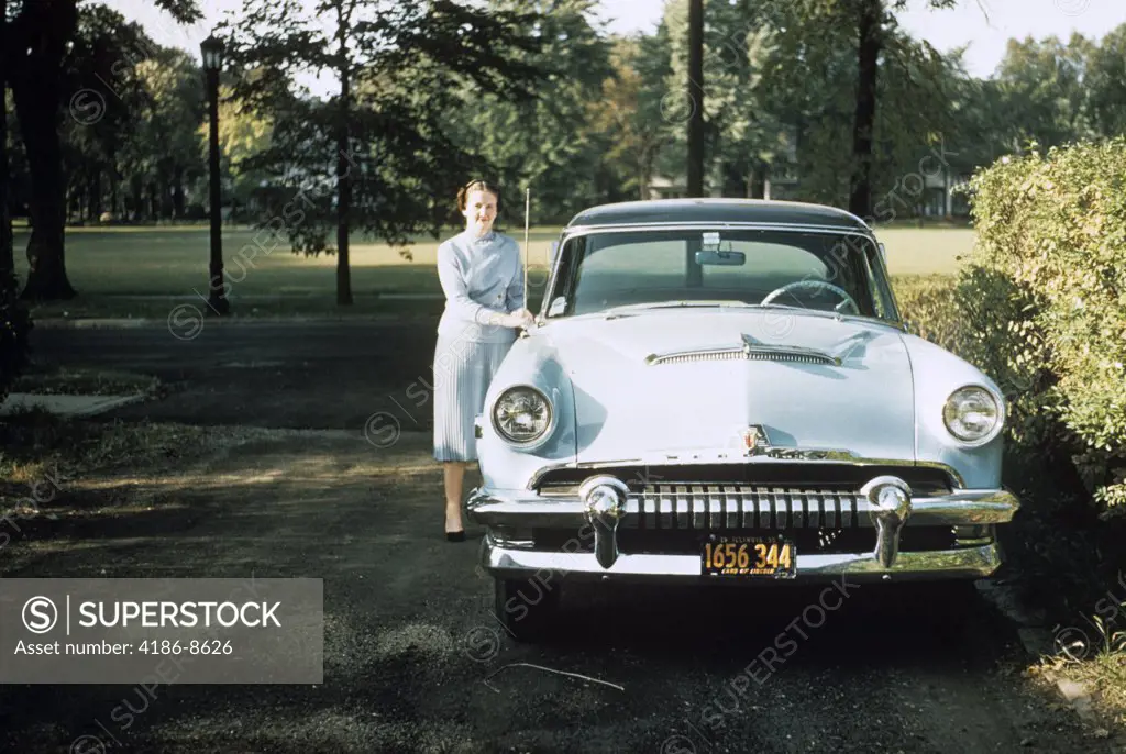 1950S 1955 Woman Standing Beside 1954 Mercury Automobile