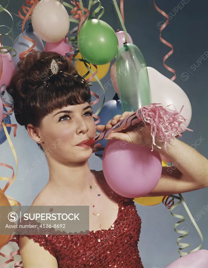 1960S Woman Blowing New Years Party Noisemaker  