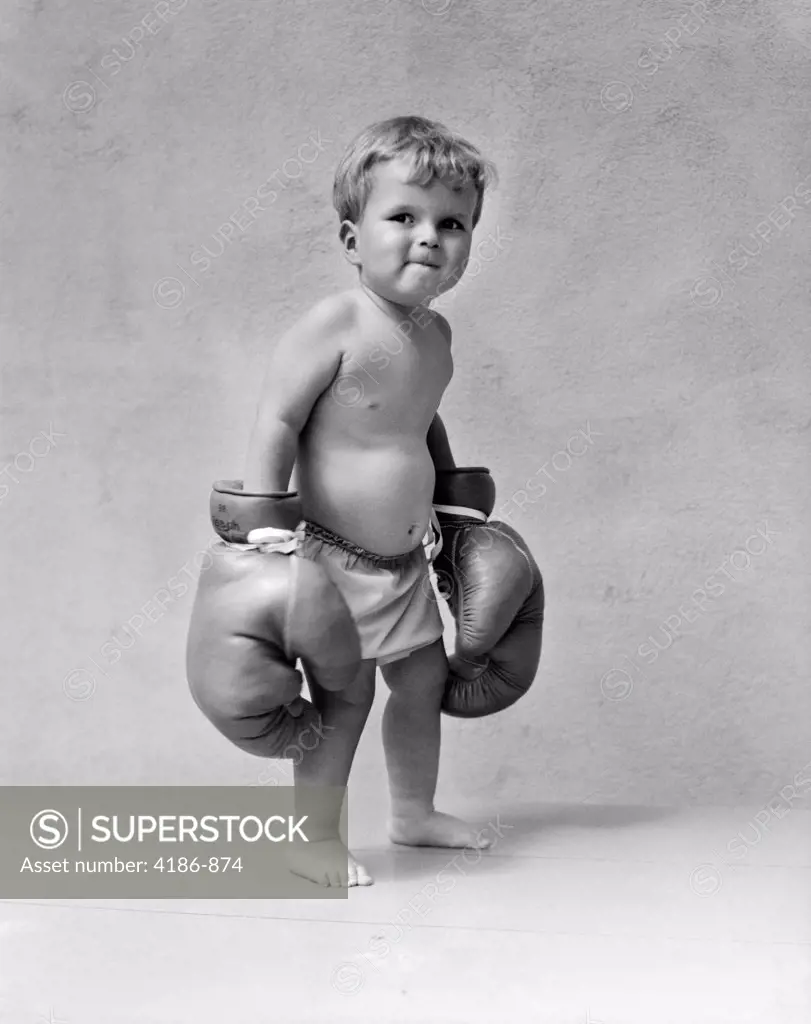 1930S Baby Boy Toddler Wearing Oversize Boxing Gloves