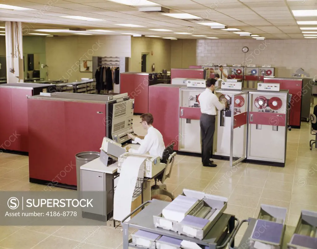 1960S Two Men Computer Programmers In Ibm 3680 Mainframe Computer Room