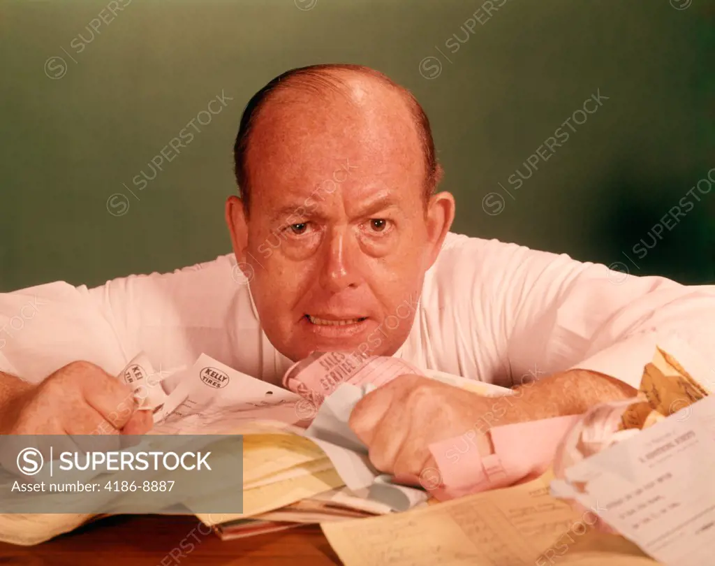 1960S Angry Man Businessman Desk Full Of Bills Paper Work Office Stress Frustration 