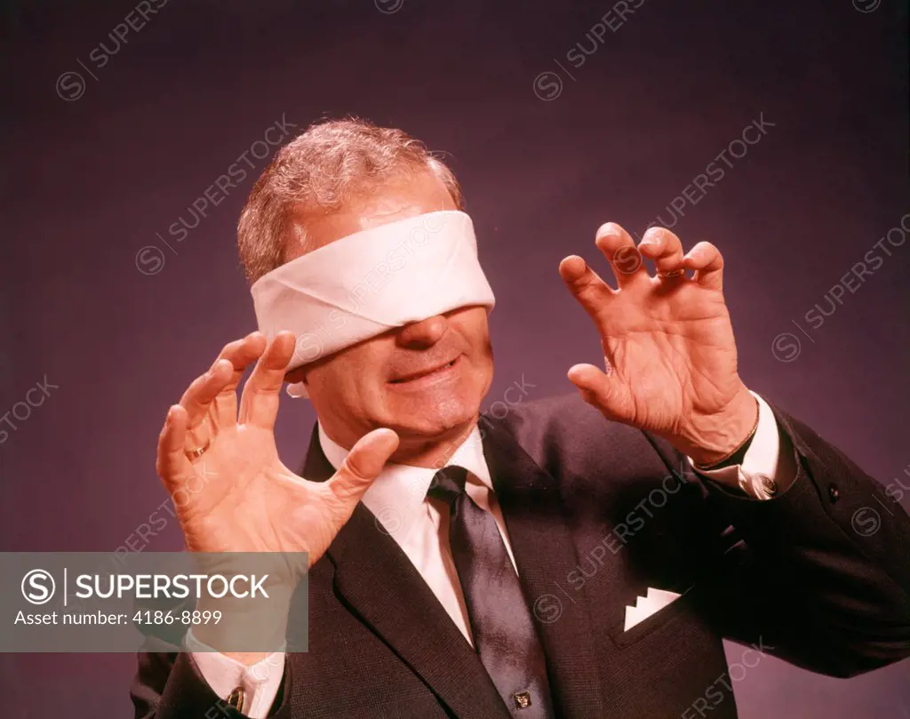 1960S Blindfolded Senior Man Businessman Arms Reaching Grasping Feeling Way 