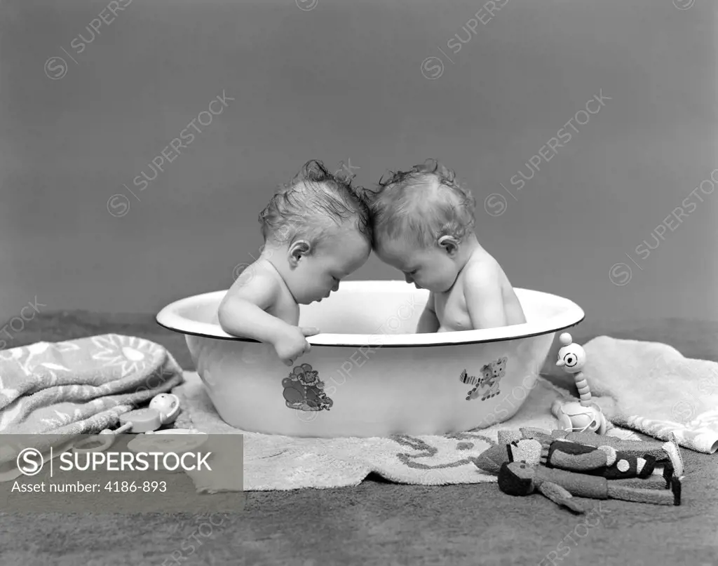 1930S Two Twin Babies In Bath Tub Looking Down