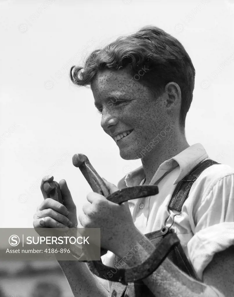 1930S Close-Up Of Smiling Freckle-Faced Boy In Overalls Holding Two Pitching Horseshoes