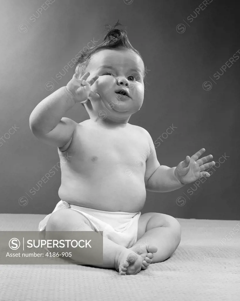 1950S Full Figure Baby Sitting Gesture Hand Touching Cheek Face Expression Funny