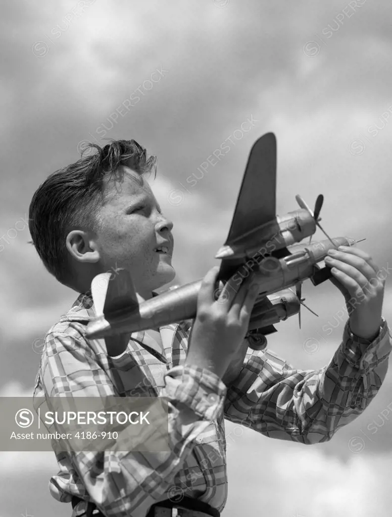 1930S 1940S 1950S Profile Freckle-Faced Boy Holding Model Propeller Airplane