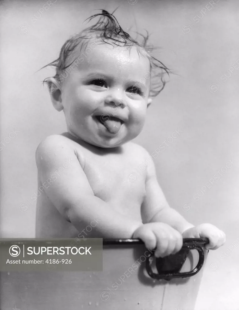 1940S 1930S Wet Baby Sitting In Tub Sticking Out Tongue