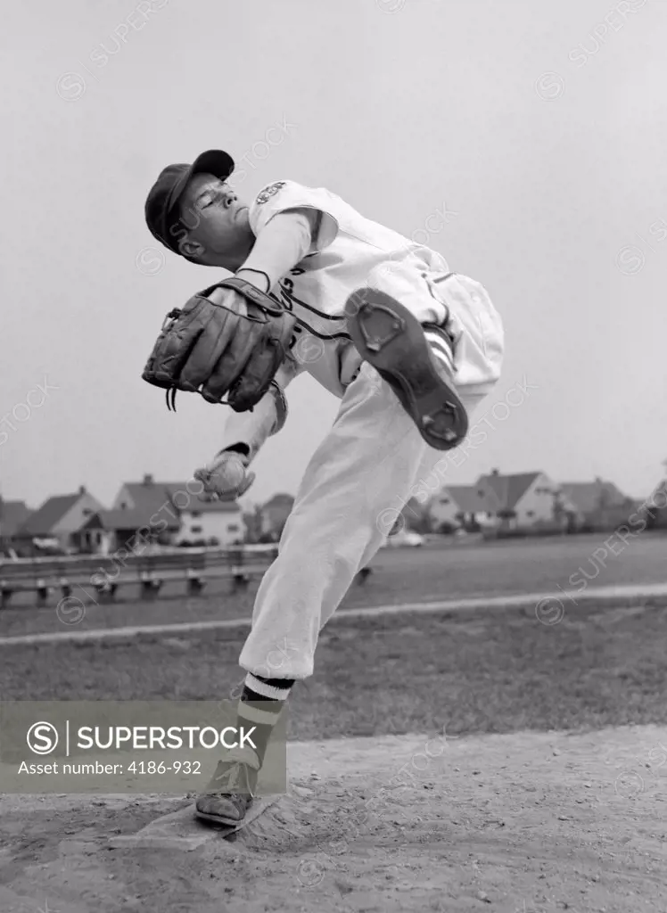 1950S Teen In Baseball Uniform Winding Up For Pitch