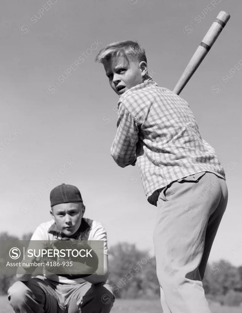 1950S Teen Boy At Bat With Catcher Crouching Behind Him