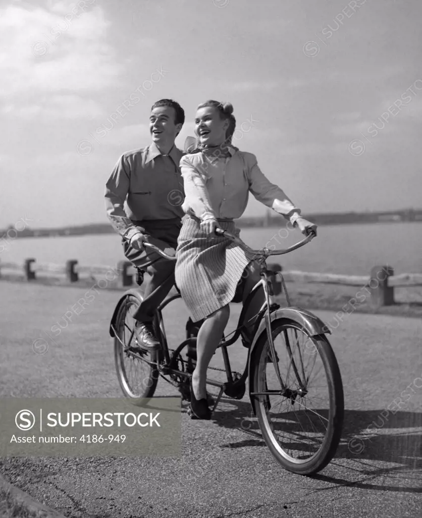 1950S Smiling Happy Couple Man Woman Riding Tandem Bicycle Built For Two