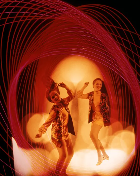 1960'S 1970'S MULTIPLE EXPOSURE WOMAN DANCING AMID PSYCHEDELIC COLOR PARTY LIGHTS