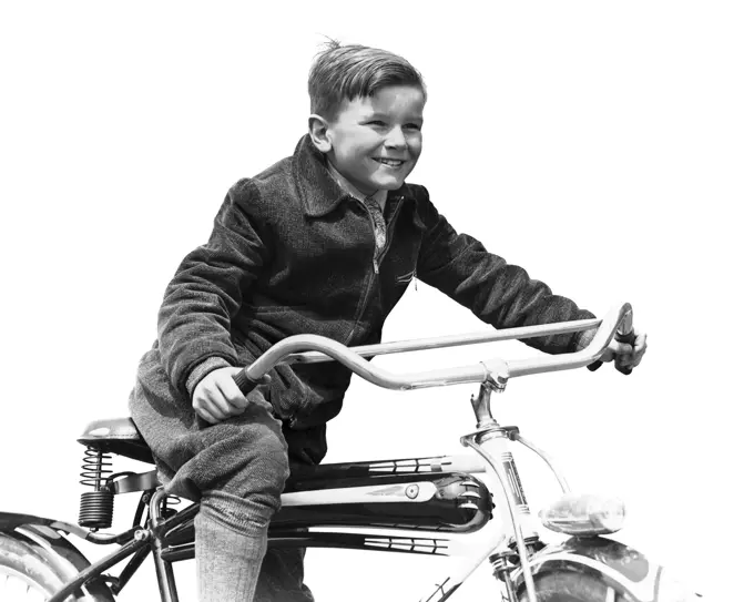 1930s SMILING BOY IN AUTUMN CORDUROY JACKET KNEE SOCKS AND PANTS  PEDALING HEAVY AMERICAN SPACE SHIP DESIGN STYLE BICYCLE