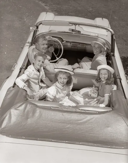 1950S Family Portrait Father Mother Son Two Daughters In Convertible Car Outdoor