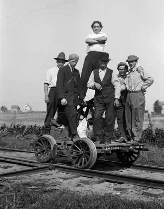 1890S 1900S Portrait Group Of Men Railroad Workers Standing On Handcar Outdoor