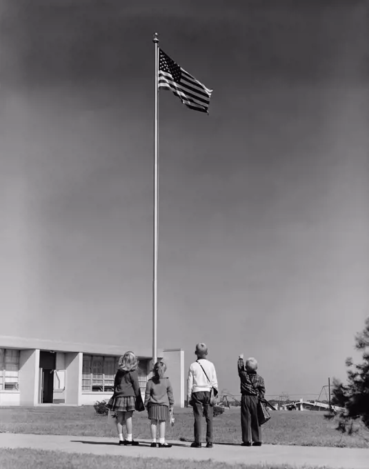 1960S Group 4 School Children Looking Up At American Flag