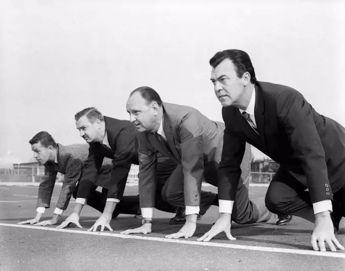 1960S Four Businessmen On The Starting Line