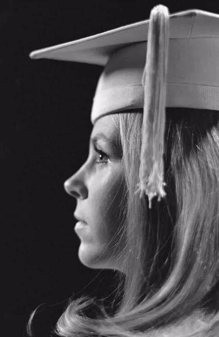 1970S Profile Blond Female Graduate Wearing White Mortarboard
