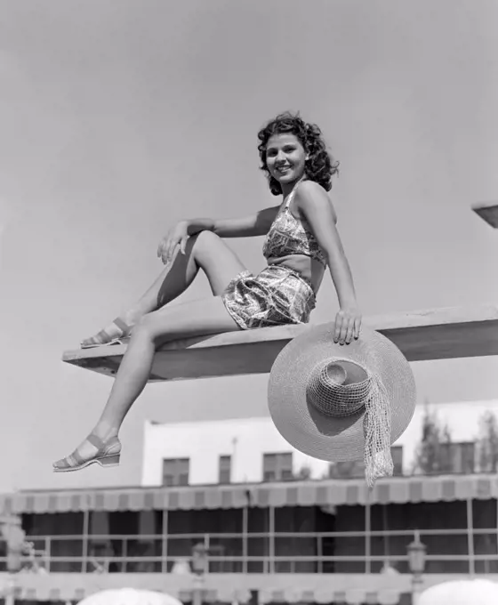 1930S 1940S Woman Holding Hat Posing Diving Board Swim Suit Pool Travel Vacation Swimming Hotel Miami Florida