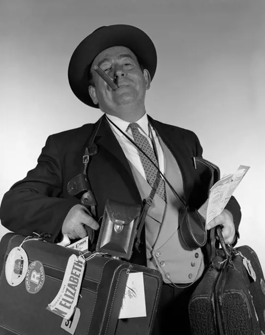 1950S Head-On Portrait Of Cigar Smoking Tourist Carrying Lots Of Luggage