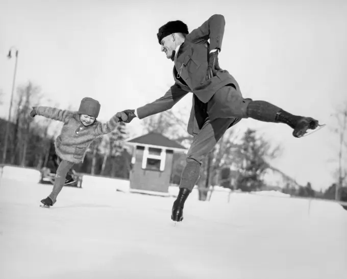1920S Man Father And Little Girl Daughter Ice Skating Outdoors In Winter