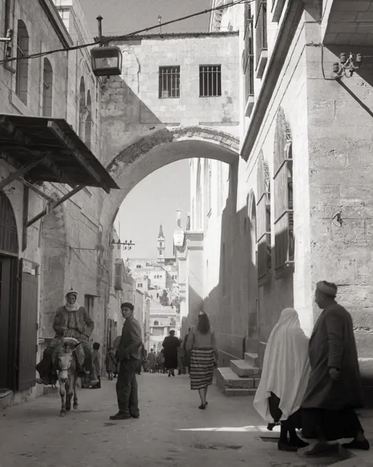 1950s CENTRAL ECCE HOMO ARCH ON VIA DOLOROSA STATION OF THE CROSS STREET SCENE OLD JERUSALEM