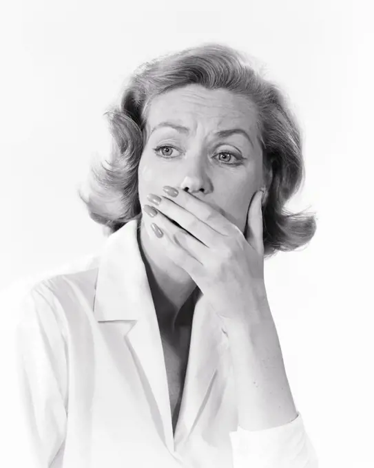 1950s 1960s SAD SHOCKED WOMAN WITH HAND COVERING HER MOUTH 