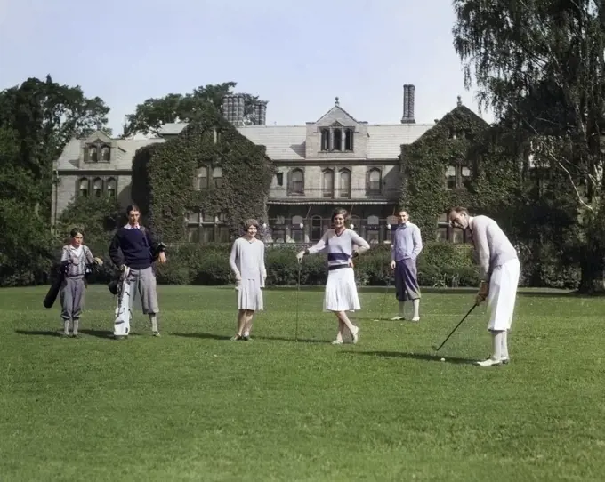 1920s TWO WOMEN TWO MEN UPPER CLASS WITH TWO BOYS CADDIES PLAYING GOLF AT THE BERKSHIRES HUNT AND COUNTRY CLUB PITTSFIELD MA USA