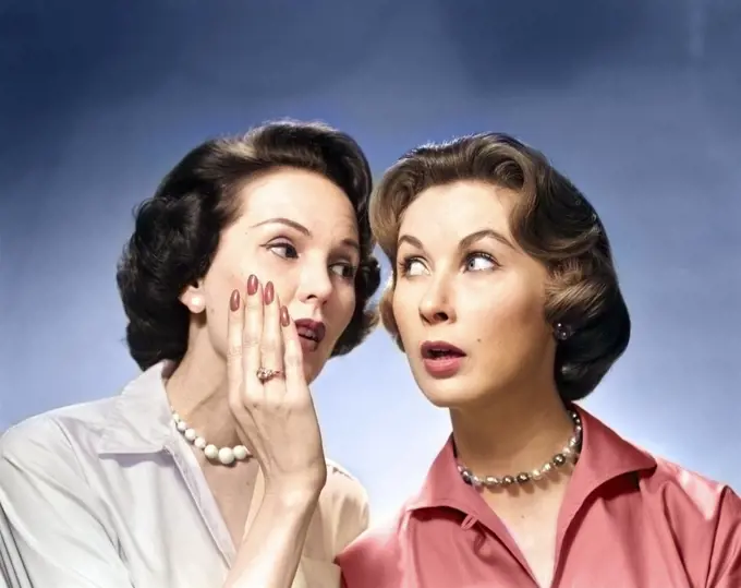 1950s 1960s TWO NOSEY WOMEN GOSSIPING ONE WHISPERING INTO THE OTHER'S EAR