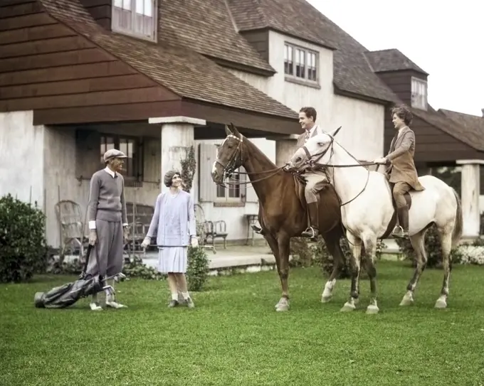 1920s 1930s TWO COUPLES ONE ON HORSES THE OTHER WEARING GOLF CLOTHES AT THE BERKSHIRE HOUND AND COUNTRY CLUB BERKSHIRES MA USA