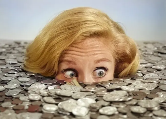 1960s BUG-EYED SURPRISED WOMAN BURIED IN COINS MONEY SYMBOLIC