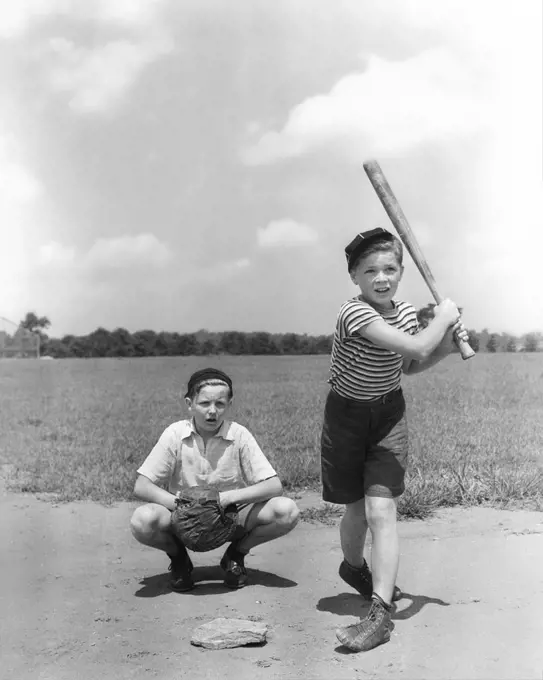 1930s TWO BOYS BATTER AND CATCHER PLAYING BASEBALL