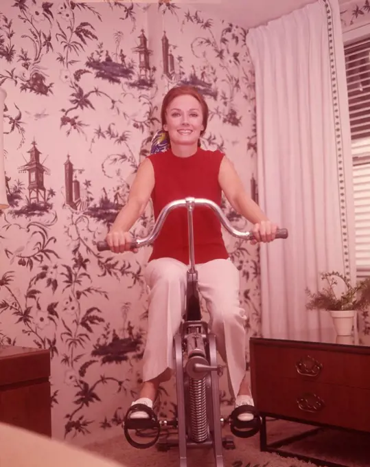 1960S Woman On Exercise Cycle