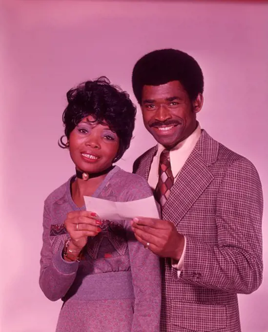 1970S African American Couple Smiling Holding Check